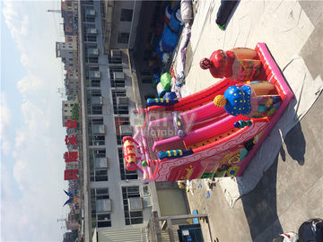 ピンク キャンデー0.55mmポリ塩化ビニールの防水シートの屋外の巨大で膨脹可能なスライド/爆発の遊園地